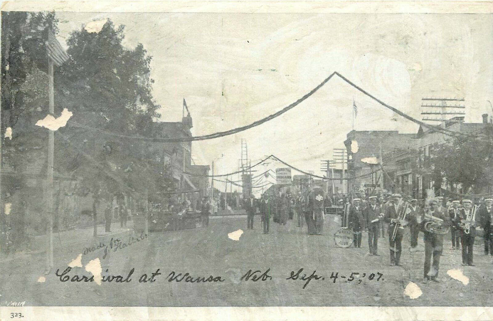 1907 Carnical Street Scene Parade, Wausa, Nebraska Postcard - As Is Damaged